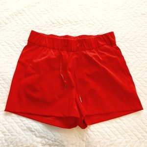 EUC Lululemon red On The Fly shorts